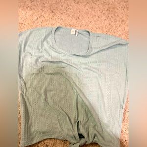 Teal colored shirt size (L)